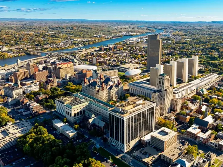 Aerial view of a city skyline along a river.